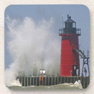 People on jetty watch large breaking waves in 2 coaster