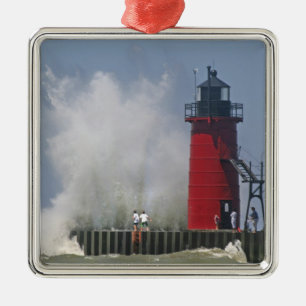 People on jetty watch large breaking waves in 2 metal tree decoration