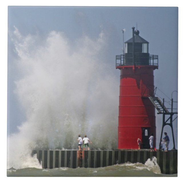 People on jetty watch large breaking waves in 2 tile (Front)
