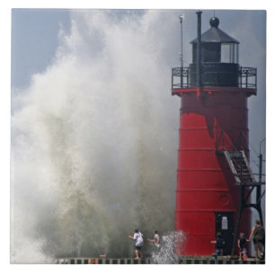 People on jetty watch large breaking waves in ceramic tile