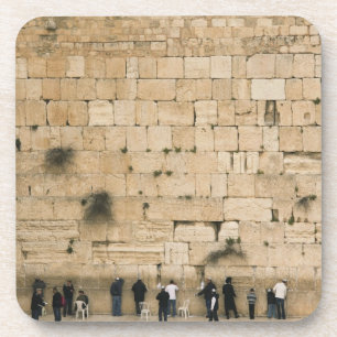 People praying at the wailing wall coaster
