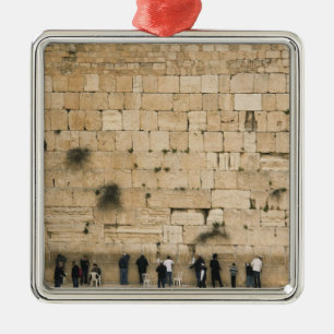 People praying at the wailing wall metal ornament