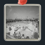 People relaxing at outdoor swimming pool B&W Metal Ornament<br><div class="desc">People relaxing at outdoor swimming pool,  (B&W),  elevated view. Copyright: George Marks</div>