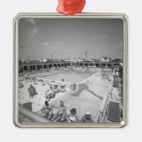 People relaxing at outdoor swimming pool B&W