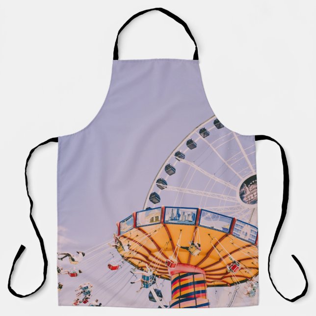 People riding on yoyo ride at daytime apron (Front)