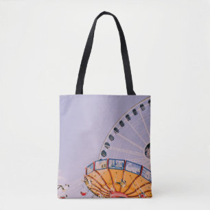 People riding on yoyo ride at daytime tote bag