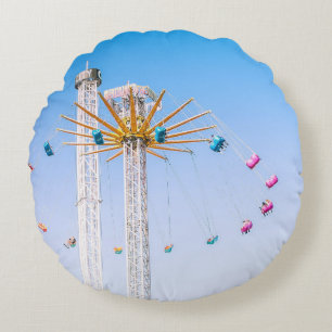 People riding swing amusement ride low-angle photo round cushion