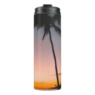 People sitting on beach near sea thermal tumbler