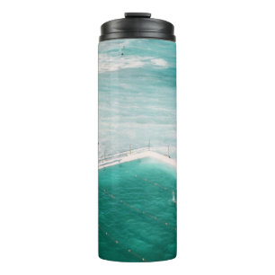 People standing and swimming on swimming pool besi thermal tumbler