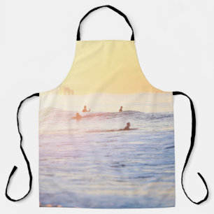 People surfing on beach apron