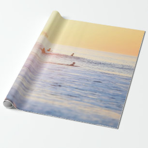 People surfing on beach wrapping paper