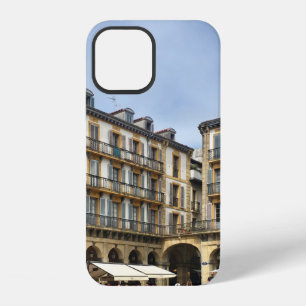 PEOPLE WALKING NEAR BEIGE CONCRETE BUILDING DURING iPhone 12 CASE