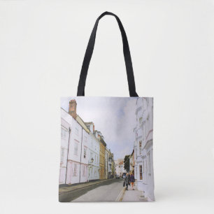 PEOPLE WALKING ON SIDEWALK BESIDE BUILDING AND ROA TOTE BAG