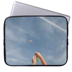 Person flying kite in the morning laptop sleeve