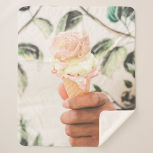Person holding ice cream cone with three flavours sherpa blanket