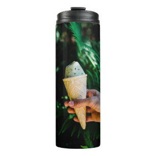 Person holding ice cream thermal tumbler