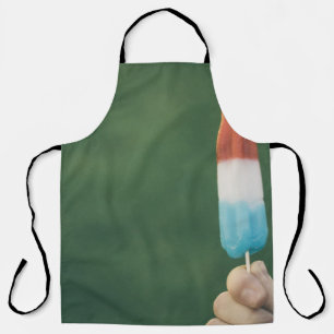 Person holding ice pop apron