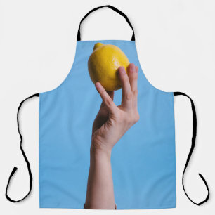 Person holding lemon apron