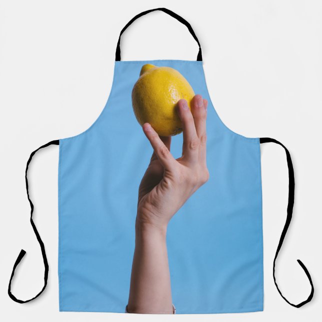 Person holding lemon apron (Front)