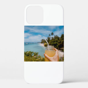 Person holding mason jar with filled with juice at iPhone 12 case
