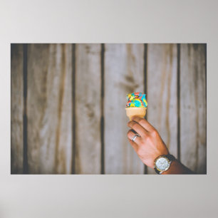 Person holding multicolored ice cream poster