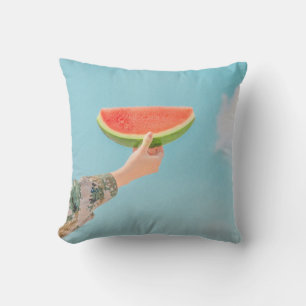 Person holding sliced watermelon cushion