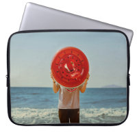 Person holding watermelon-themed inflatable ring