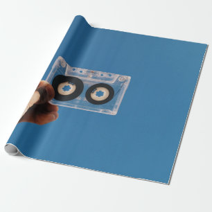 Person holding white and black cassette tape wrapping paper