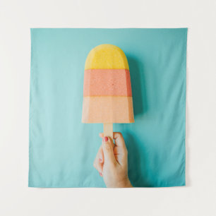 Person holding yellow and brown ice cream cone tapestry