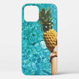 Person holding yellow pineapple iPhone 12 case