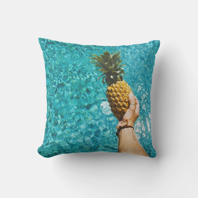 Person holding yellow pineapple cushion (Front)