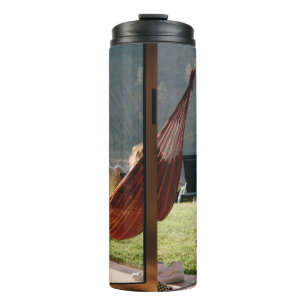 Person on brown swing thermal tumbler