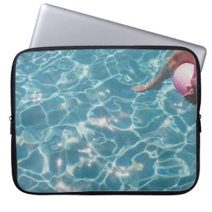 Person on swimming pool laptop sleeve