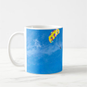 Person paragliding outdoors coffee mug
