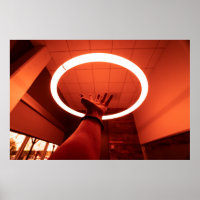 PERSON REACHING ROUND TURNED-ON FLUORESCENT LAMP I