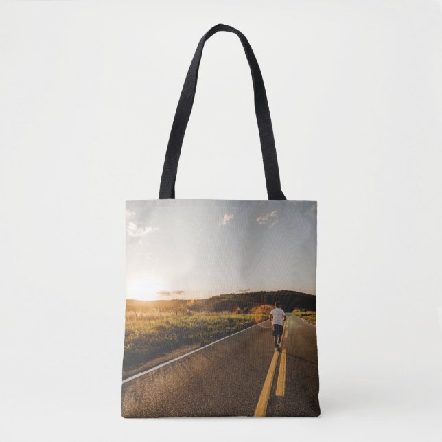 Person running in road in the morning tote bag (Front)
