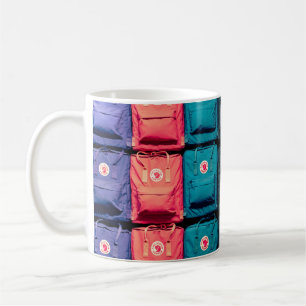 Person showing assorted-colour bags coffee mug