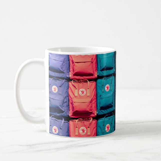 Person showing assorted-colour bags coffee mug (Left)