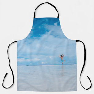 Person standing in body of water apron