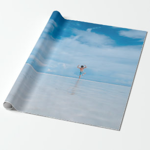 Person standing in body of water wrapping paper