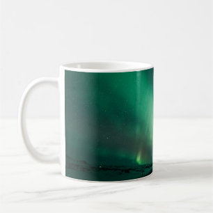 PERSON STANDING IN FRONT OF AURORA LIGHTS COFFEE MUG