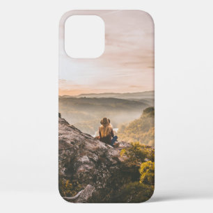 PERSON STANDING ON CLIFF NEAR TREE ON MOUNTAIN iPhone 12 CASE