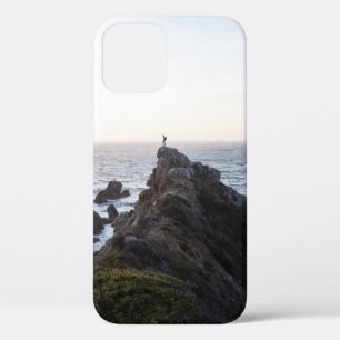 PERSON STANDING ON ROCK CLIFF NEAR BODY OF WATER iPhone 12 CASE