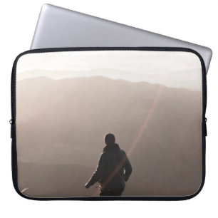 Person standing on rock laptop sleeve