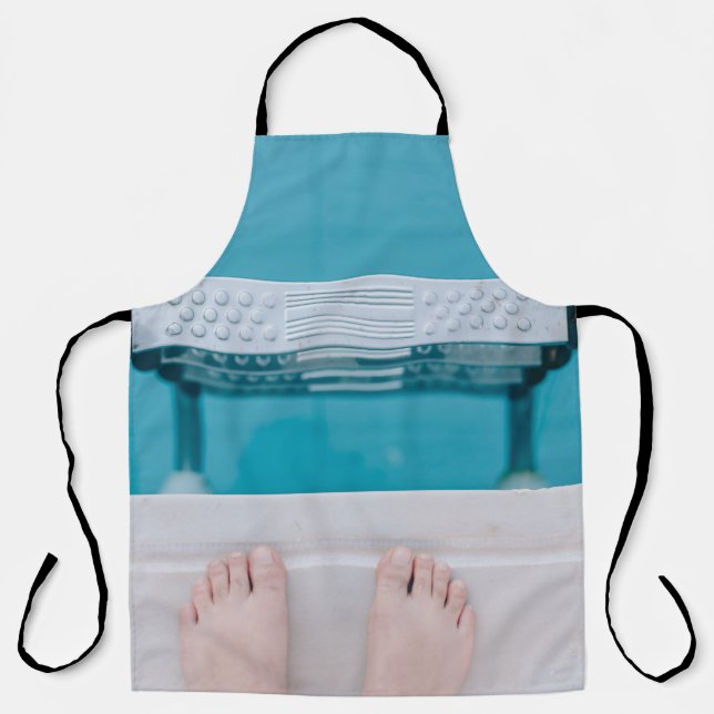 Person standing on swimming pool ladder apron (Front)