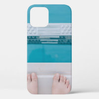 Person standing on swimming pool ladder