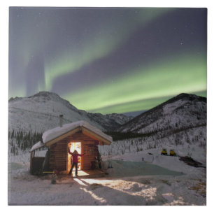 Person stands in doorway of Caribou Bluff cabin Tile