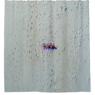 Person sunbathing at the beach shower curtain