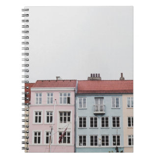 PERSON TAKING PICTURE OF STRUCTURES NOTEBOOK