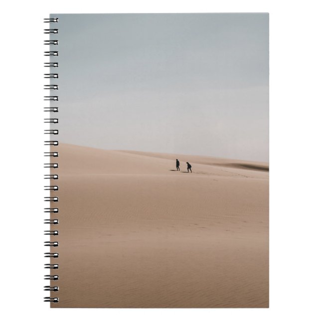 PERSON WALKING ON BROWN SAND DURING DAYTIME NOTEBOOK (Front)